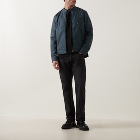 Model wearing Belstaff petrol casual jacket with black trousers and black shoes.