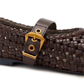 All Saints brown woven leather flat shoe with gold-tone buckle detail, close-up showing interlaced texture and smooth leather strap