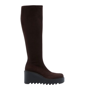Carl Scarpa brown suede knee-high boot with chunky ridged wedge sole, shown in profile on white background