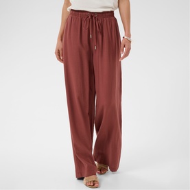 Model wearing Kaffe henna wide-leg drawstring trousers, styled with nude heeled sandals and a white bracelet.