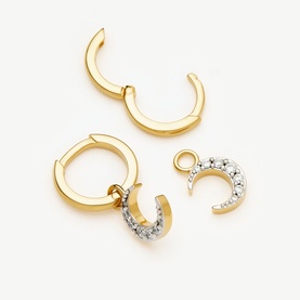 Missoma gold hoop earrings with detachable crescent moon crystal charm pendants, shown as a set of three pieces
