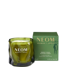 Neom Organics Perfect Peace Scented Candle in green glass vessel with three wicks, shown with matching green gift box