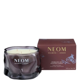 Neom Organics Sparkling Joy scented candle in smoky grey glass vessel with three wicks, shown with burgundy gift box