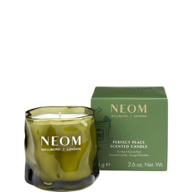 Neom Organics Perfect Peace Scented Candle in dark green glass vessel with matching green gift box