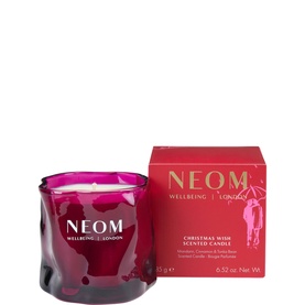 Neom Organics Christmas Wish Scented Candle in pink glass vessel with matching red gift box