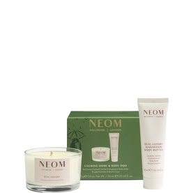 Neom Organics Calming Home & Body set featuring a scented candle and body butter tube in green and white packaging.
