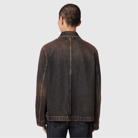 Model wearing All Saints washed brown denim jacket, rear view, relaxed fit with centre back seam detail.