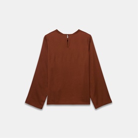 Rust brown long-sleeve top with wide sleeves, round neckline, and keyhole back detail, laid flat on white background.