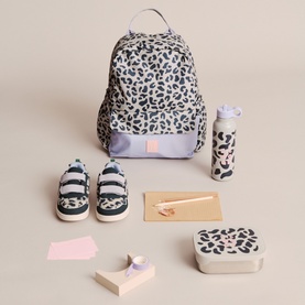 LIEWOOD Mega Leo Mist backpack styled with matching lunchbox, water bottle, mini trainers and stationery on neutral background