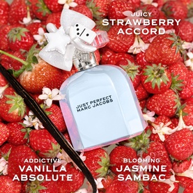 Marc Jacobs Just Perfect Eau de Parfum bottle with bow-shaped cap, surrounded by fresh strawberries, with fragrance notes text overlay