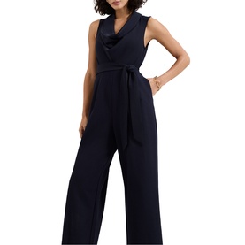 Model wearing Phase Eight blue sleeveless wide-leg jumpsuit with cowl neck and tie waist belt