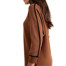 Model wearing Phase Eight brown dress with black contrast trim detail on sleeves, shown from side angle