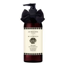 Jo Malone x Wildwash Orange & Cedarwood Dog Shampoo in dark amber pump bottle with black bow ribbon detail