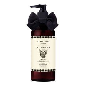 Jo Malone x Wildwash Orange & Cedarwood Dog Shampoo in amber pump bottle with black bow ribbon decoration