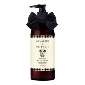 Jo Malone x Wildwash Orange & Cedarwood Dog Shampoo in dark amber pump bottle with black bow ribbon detail