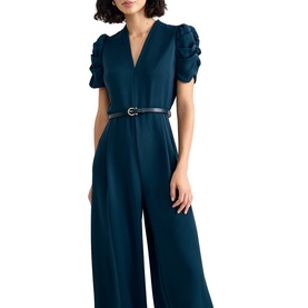 Model wearing Phase Eight blue wide-leg jumpsuit with ruffled short sleeves, V-neckline, and slim belt