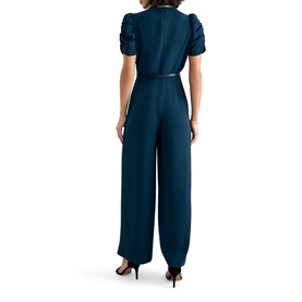 Model wearing Phase Eight blue wide-leg jumpsuit with ruched short sleeves and belted waist, back view, styled with black heels