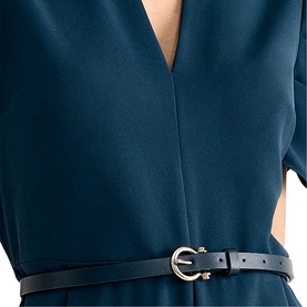 Model wearing Phase Eight blue V-neck dress with short sleeves, styled with a slim black belt with silver buckle detail.