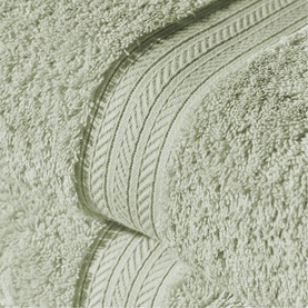 Christys Thyme bath towelling close-up showing soft looped pile and woven border detail in sage green