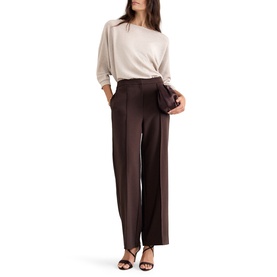 Model wearing Phase Eight wide-leg trousers in dark brown with cream batwing top and black heeled sandals, carrying small clutch bag