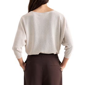 Model wearing Phase Eight gold knit batwing-sleeve sweater, styled with dark chocolate wide-leg trousers, rear view