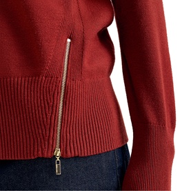 Phase Eight orange knit zip-front jumper, close-up of gold zip detail and ribbed hem, styled with dark denim jeans