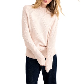 Model wearing Phase Eight pink diamond-knit mock-neck sweater with raglan sleeves, styled with dark navy trousers