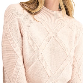 Model wearing Phase Eight pink cable-knit crew neck jumper, close-up detail of diamond stitch pattern on sleeves and body