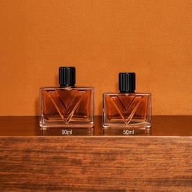 Valentino Vendetta Uomo Eau de Parfum For Men in 90ml and 50ml bottles, amber glass with black caps, displayed on wooden surface