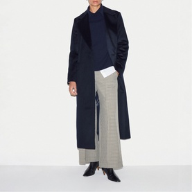 Model wearing Jigsaw navy long coat, styled with navy jumper, houndstooth wide-leg trousers and black heeled ankle boots.