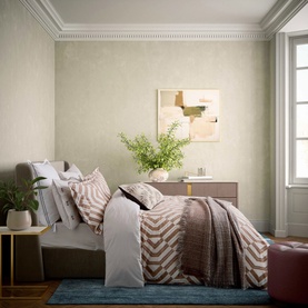 Bedroom styled with taupe and white chevron-print bedding set, paired with grey cushions, wooden bedside table and abstract wall art