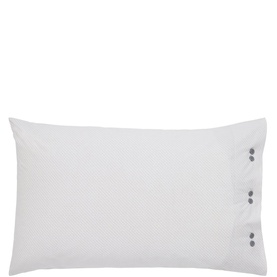 White pillowcase with three small grey button fastening detail on right edge, against white background