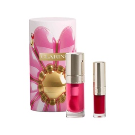 Clarins Lip Comfort Oil Gift Set with gold bauble compact and mini lip oil, presented in a pink floral cylindrical gift box