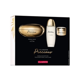 Clarins Precious Exceptional Skincare Gift Set with gold cream jar, serum bottle, and mini cream in black gift box