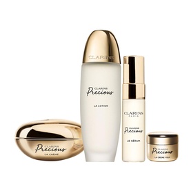 Clarins Precious Complete Ritual Gift Set featuring La Cr&egrave;me, La Lotion, Le S&eacute;rum and La Cr&egrave;me Yeux in gold packaging