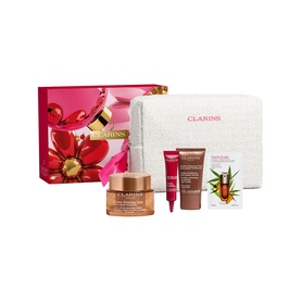 Clarins Extra-Firming Gift Set with cream, serum, and treatments displayed beside a white cosmetic pouch and floral gift box
