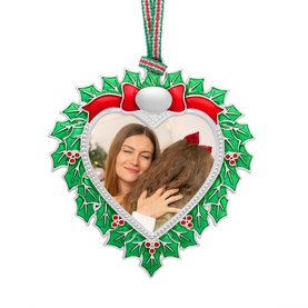 Newbridge silver heart-shaped Christmas ornament with holly wreath frame, red bow, and photo insert, hanging from striped ribbon