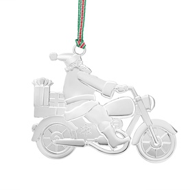 Newbridge silver Christmas tree ornament featuring Santa riding a motorcycle with gifts, hung with red and green ribbon