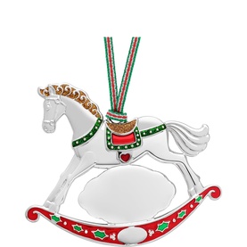 Newbridge silver rocking horse Christmas ornament with red and green enamel holly detail, hung on a festive striped ribbon