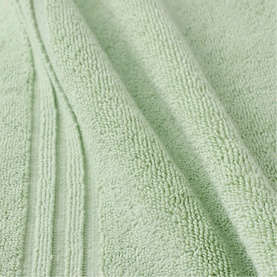 Christys green bath towel, soft terry cloth texture with ribbed border detail, close-up fabric shot