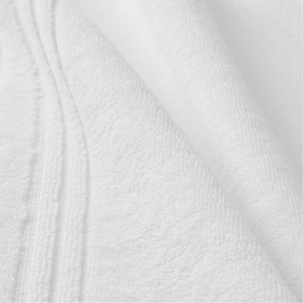 Christys white bath towelling close-up showing soft looped texture and woven stripe border detail