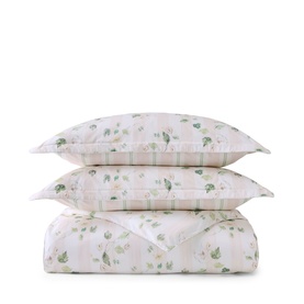 Christys green floral duvet and pillow set, stacked neatly, featuring delicate leaf and bloom print on white ground