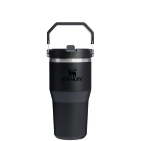 Stanley black insulated tumbler with flip carry handle, straw lid, and stainless steel base detail