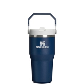 Stanley tumbler in dark navy with white flip lid and folding carry handle, insulated stainless steel design