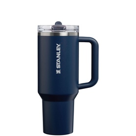Stanley tumbler in Dark Navy with handle, flip straw lid, and embossed logo. Large insulated travel cup.
