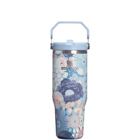 Stanley tumbler in Blue Dream Wildflower print with floral pattern, light blue lid with carry handle and straw opening