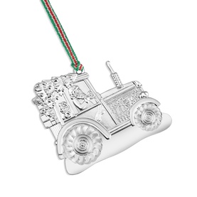 Newbridge silver tractor Christmas tree ornament with embossed floral detail, hung on a red and green striped ribbon.