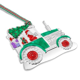 Newbridge silver enamel Christmas tractor ornament with Santa, green tree, and gifts detail, hung on red and green ribbon