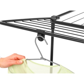 Brabantia Matt Black drying rack close-up showing bungee hook attachment and hanging laundry bag in use