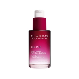 Clarins L'Elixir Hair Oil in a deep red glass bottle with pink cap and pump dispenser